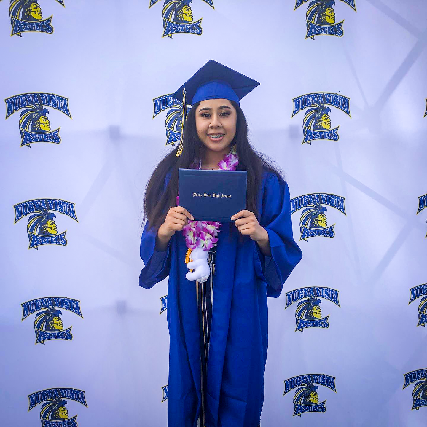 NVHS graduate poses with diploma