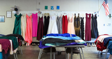 Prom dresses hung up in a line at the RHS Wellness Center