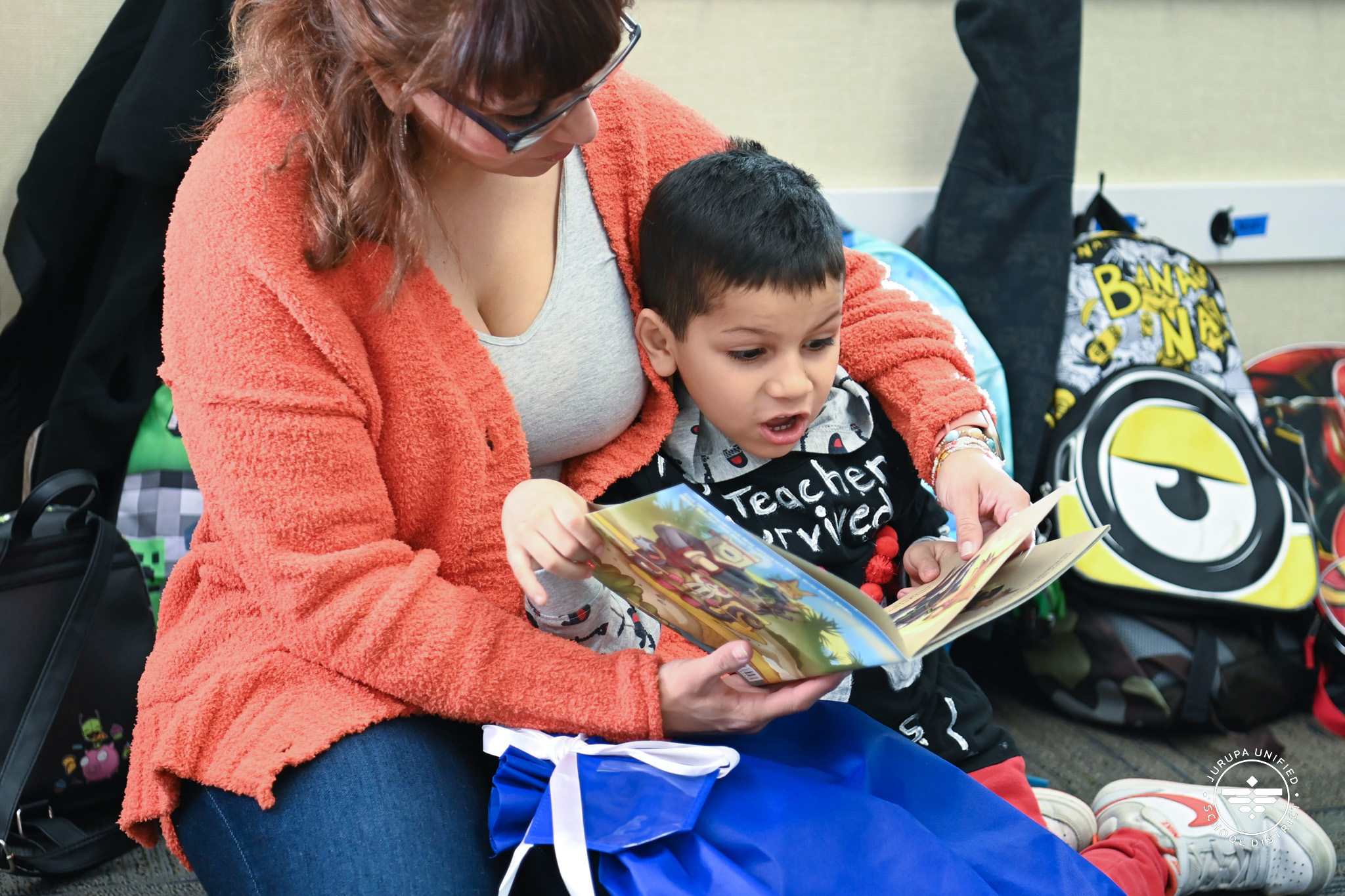 Troth parent reading with child