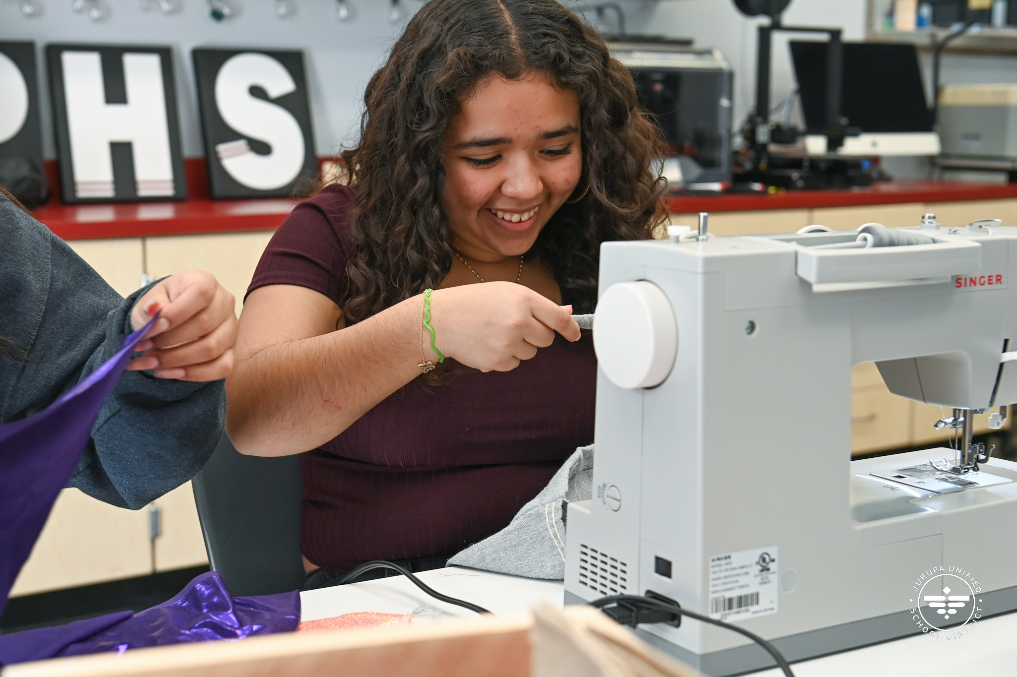 student using a sewing machine