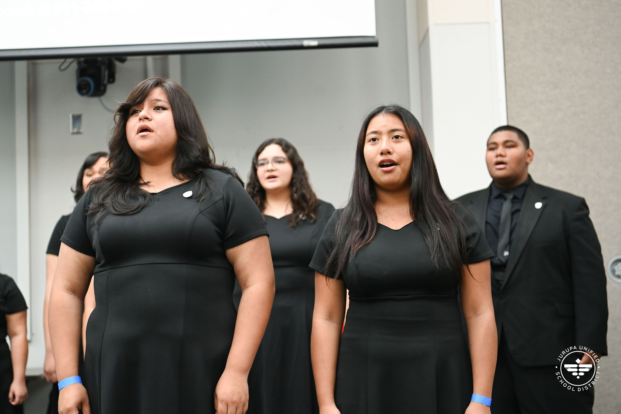 RHS choir students singing at the We heART the ARTs night