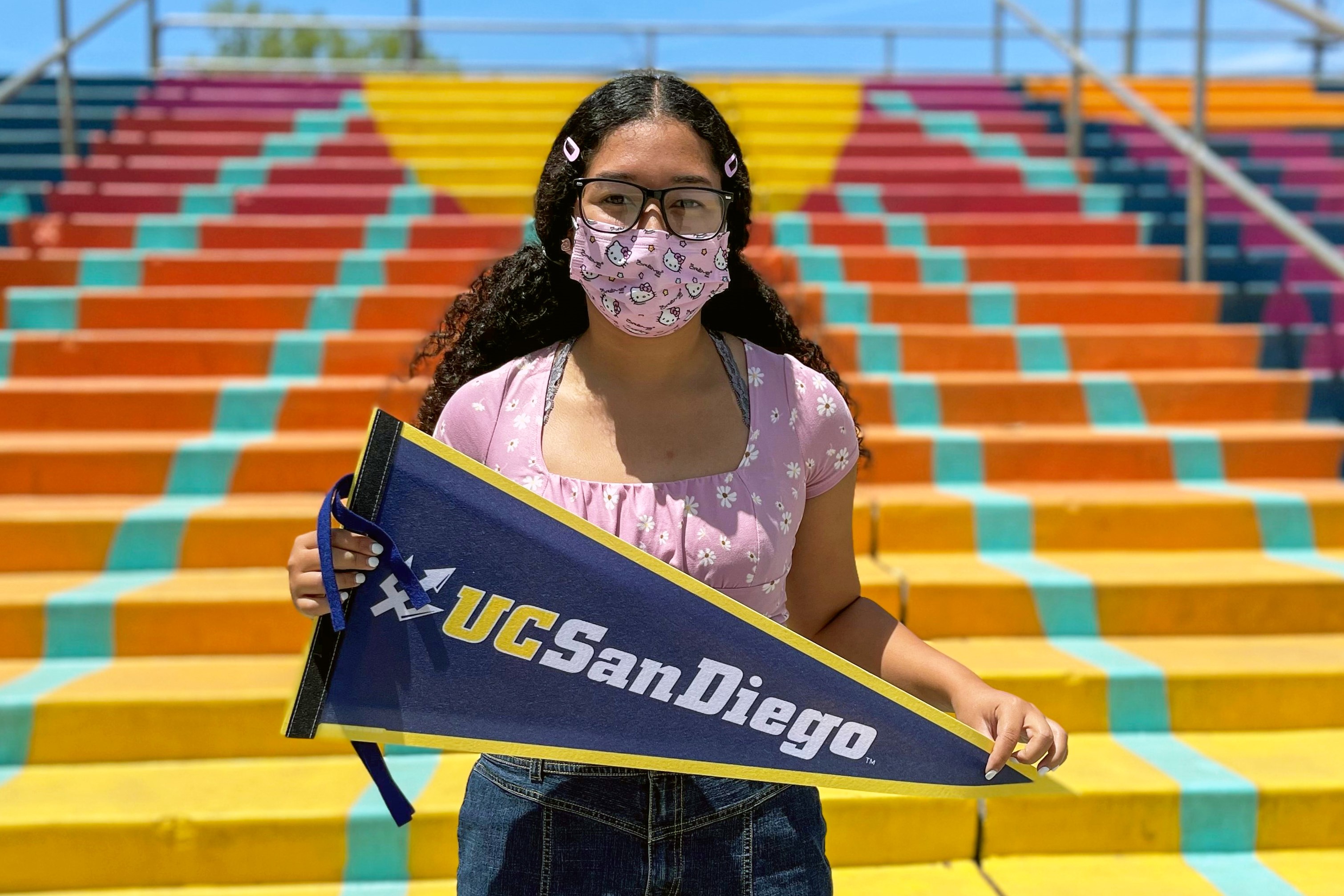 Kylie Carmona with UCSD pennant
