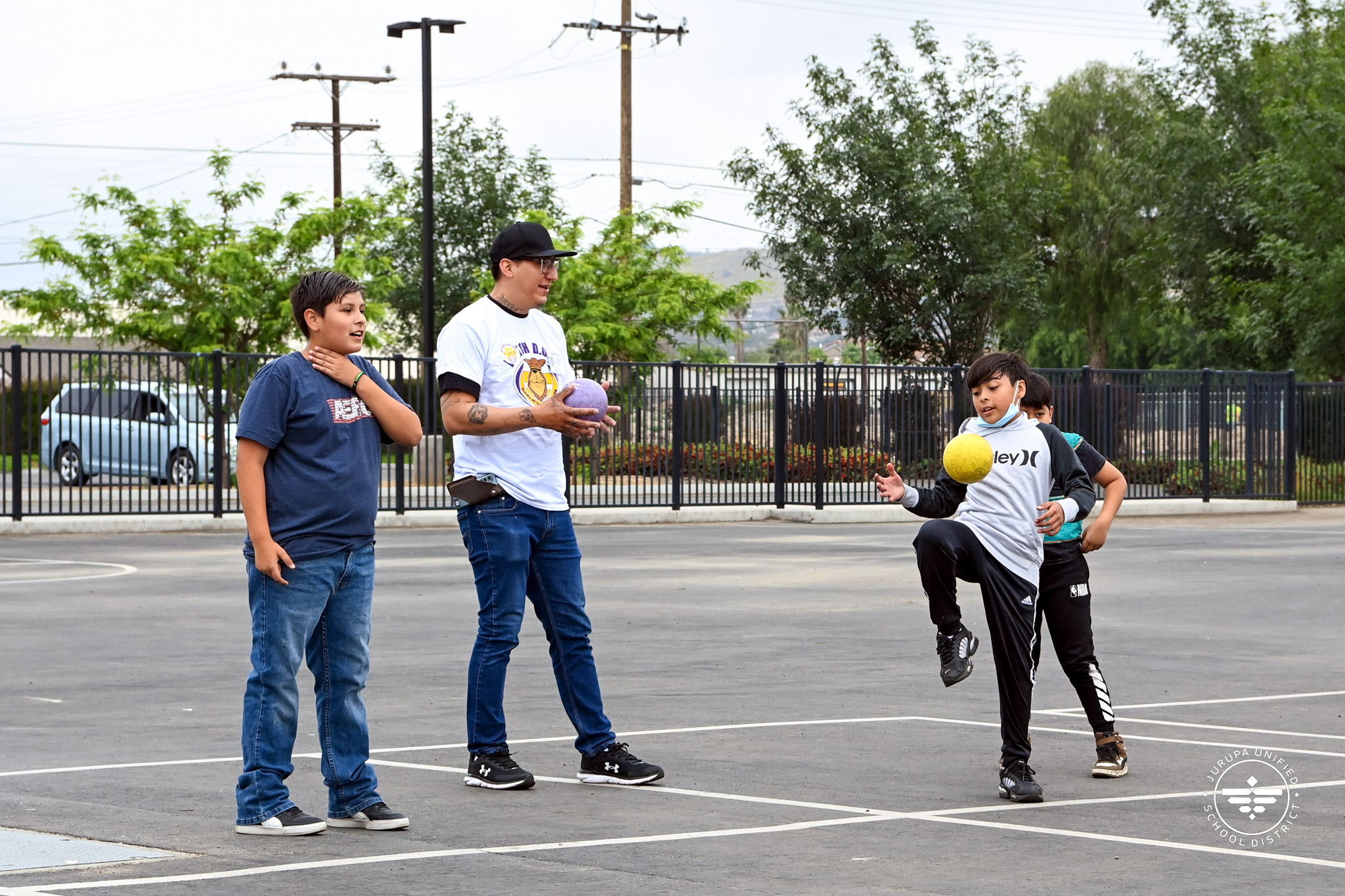 William Arata playing dodgeball with Ina students