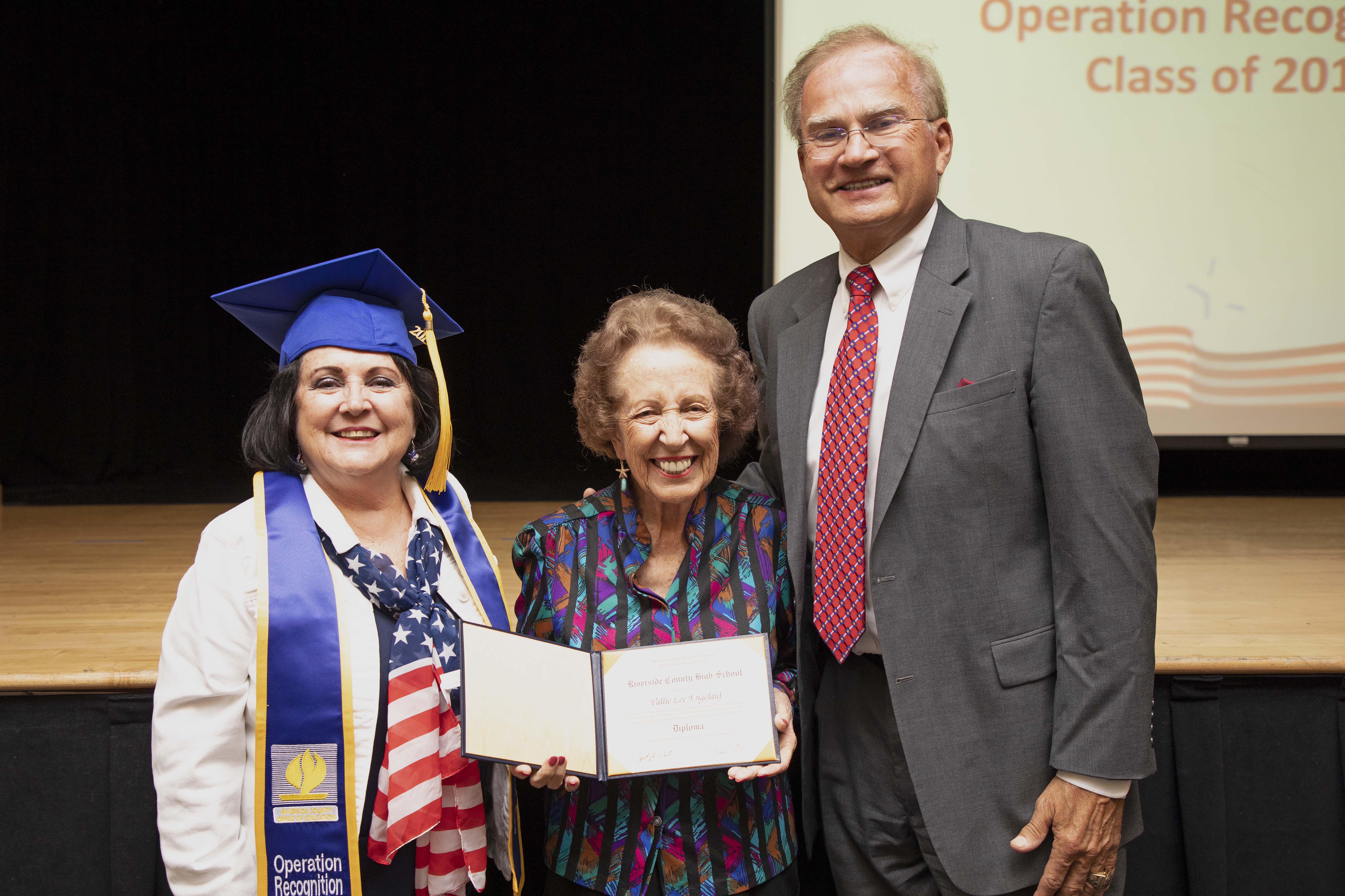 Linda Chard accepts Father's diploma