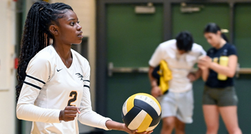 RHS volleyball player preparing to serve