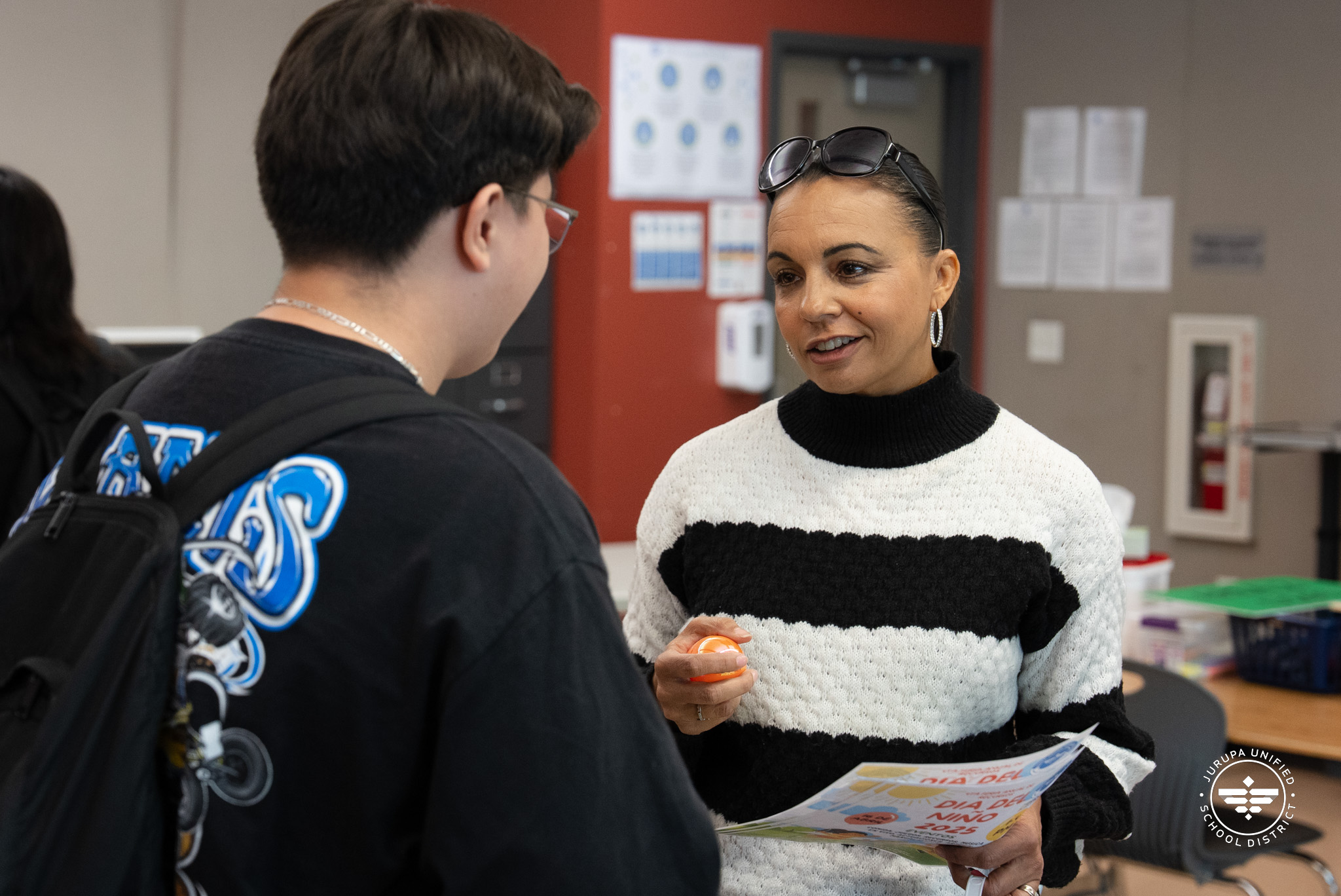 Ms. Mann talking to a student