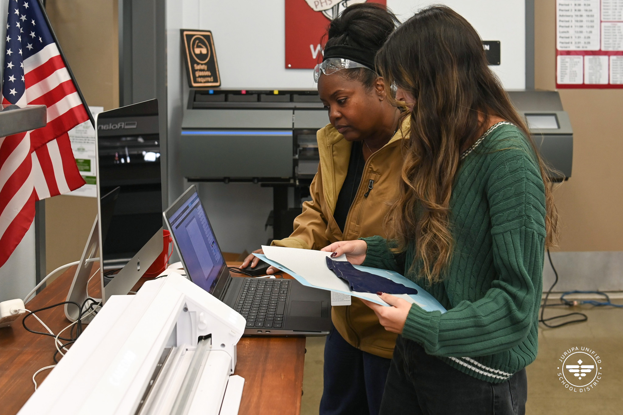 Ms. Jones helping Natalie with a project