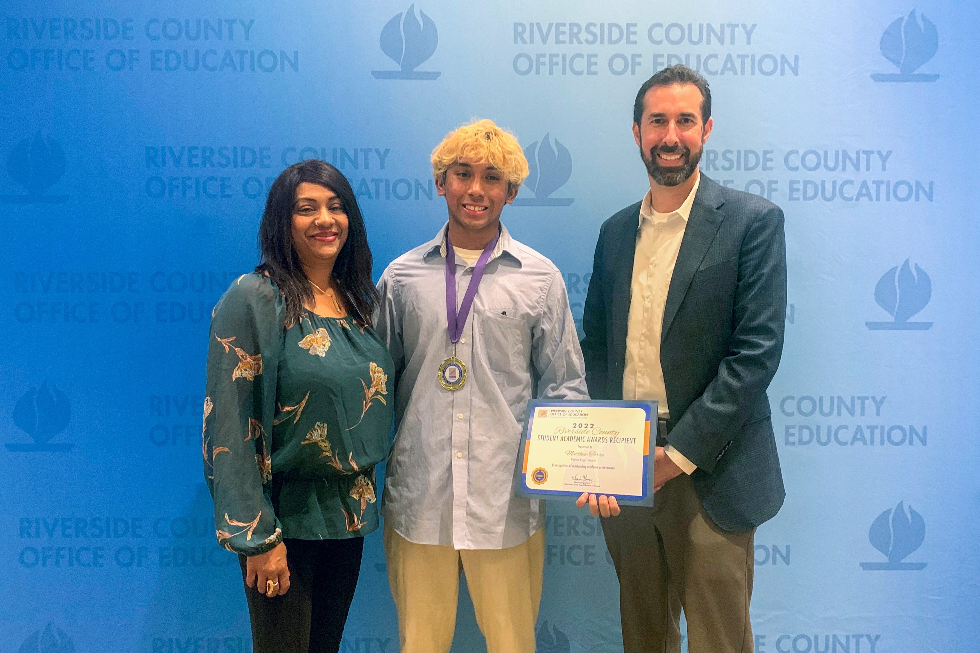 Matthew Torre with scholarship award