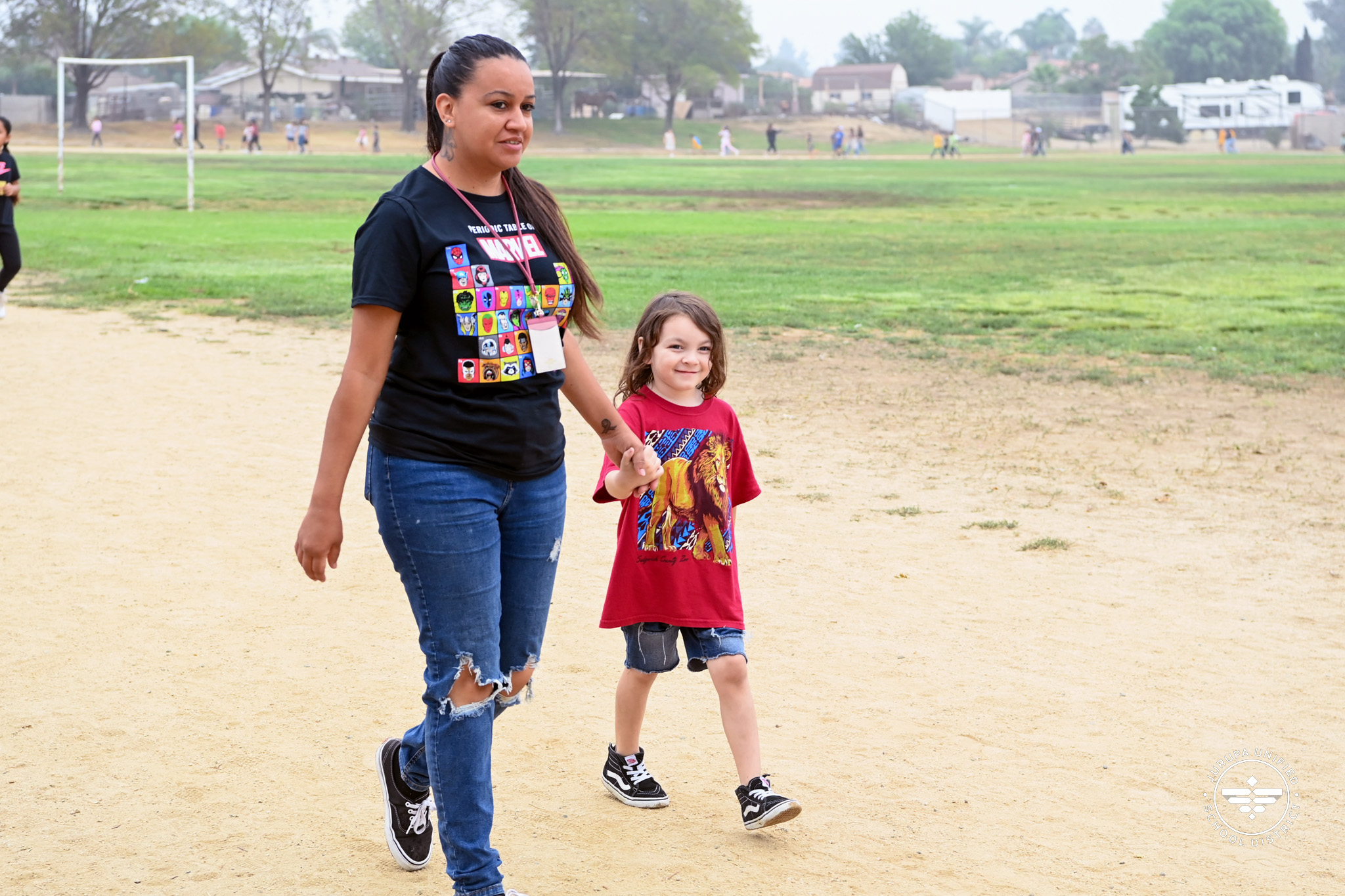 Sky Country staff member helping a student around the track
