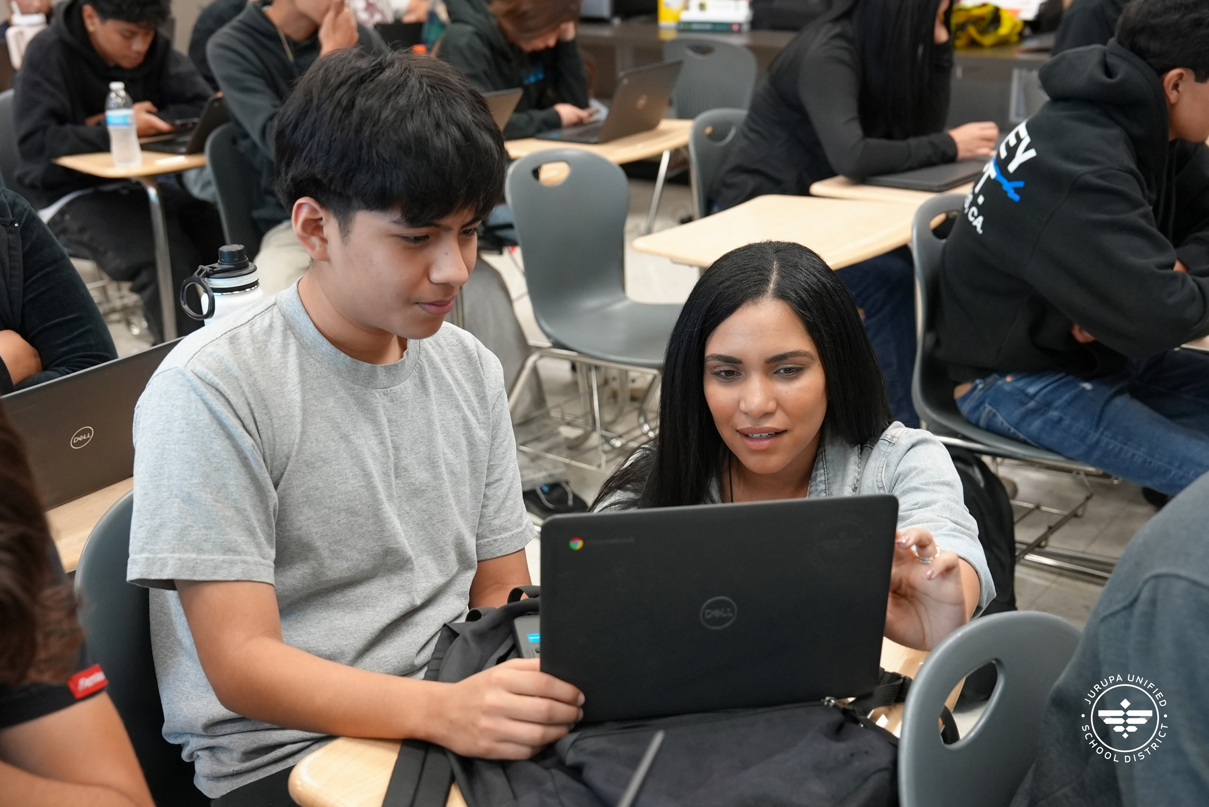 Daniela Luchembe helps a Patriot High School Student